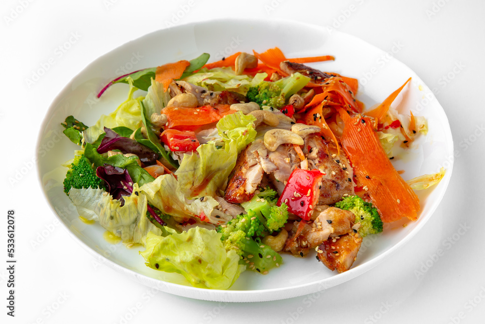 Salad of vegetables and nuts. Balanced, nutritious, tasty and nutritious food. Ready-made menu for a restaurant or for delivery. Dish in a white plate isolated on a white background. Salad of vegetables and nuts. Balanced, nutritious, tasty and nutritious food. Ready-made menu for a restaurant or for delivery. Dish in a white plate isolated on a white background.
