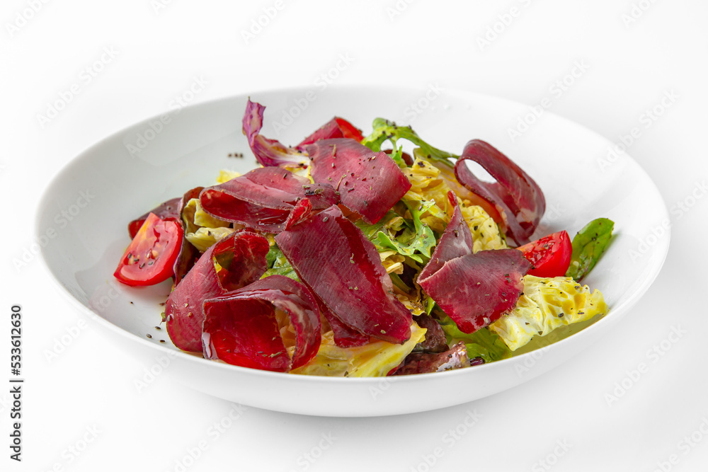 Dried dry age meat with vegetables. Balanced, nutritious, tasty and nutritious food. Ready-made menu for a restaurant or for delivery. Dish in a white plate isolated on a white background. Dried dry age meat with vegetables. Balanced, nutritious, tasty and nutritious food. Ready-made menu for a restaurant or for delivery. Dish in a white plate isolated on a white background.