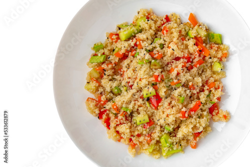 Millet porridge with vegetables. Balanced, nutritious, tasty and nutritious food. Ready-made menu for a restaurant or for delivery. Dish in a white plate isolated on a white background.