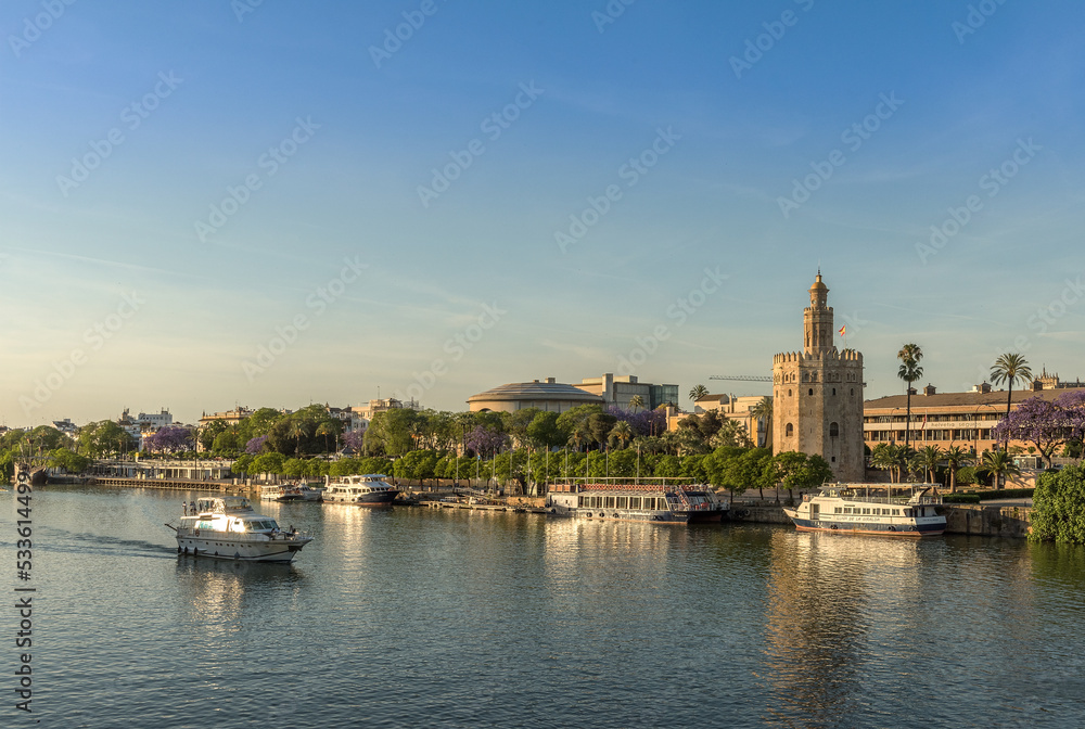 View of the Guadalquivir River and the Torre del Oro, Seville, Spain View of the Guadalquivir River and the Torre del Oro, Seville, Spain