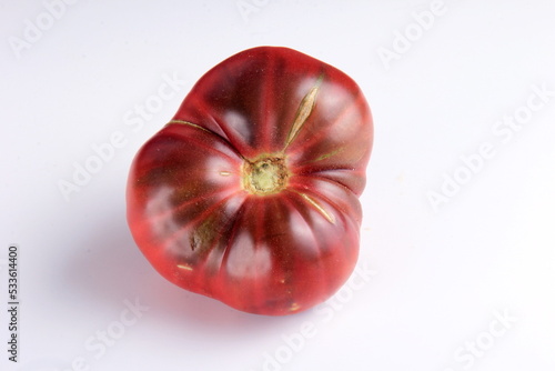 Black tomato on a white background