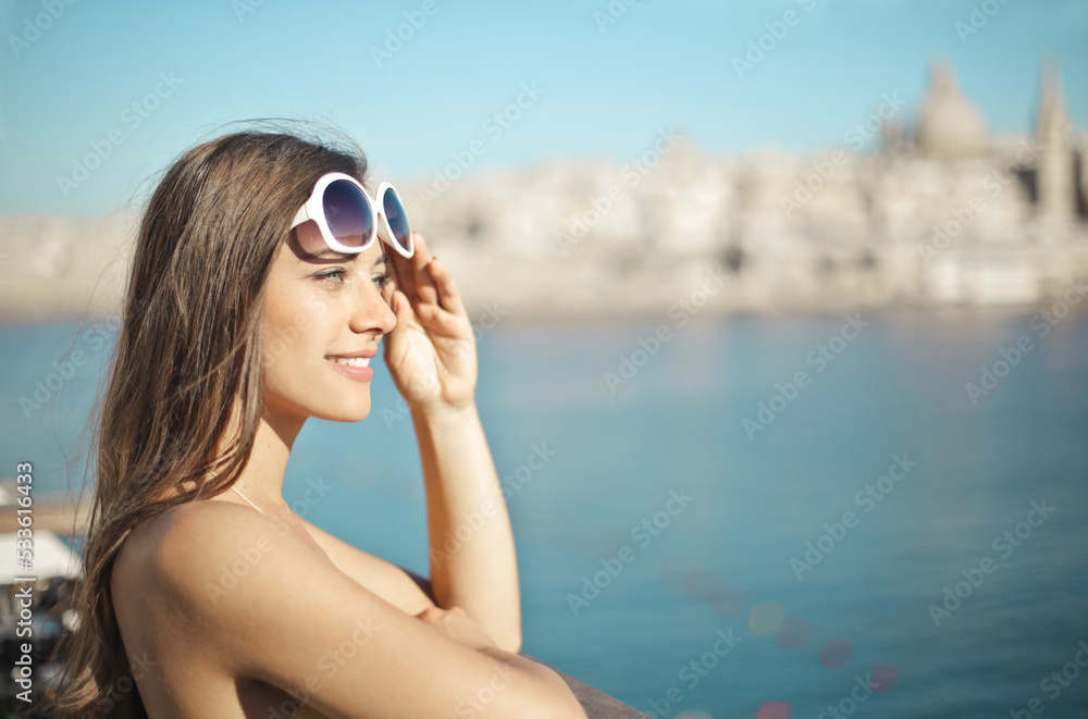 young woman on a bridge looks at the view young woman on a bridge looks at the view