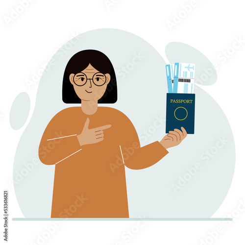 A woman holds a passport with air tickets. The woman shows the boarding pass. Travel concept.