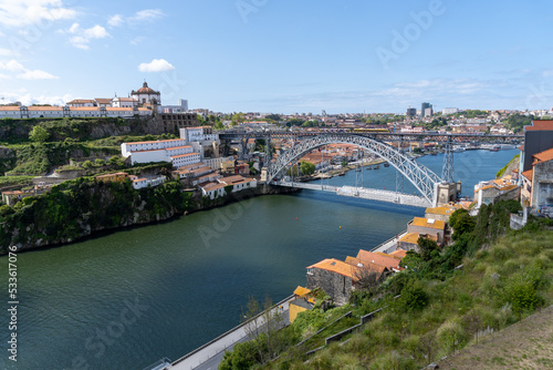 Metallic bridge of Don Luis I in Porto, with a part scaffolded for works, on a sunny day. © Montse