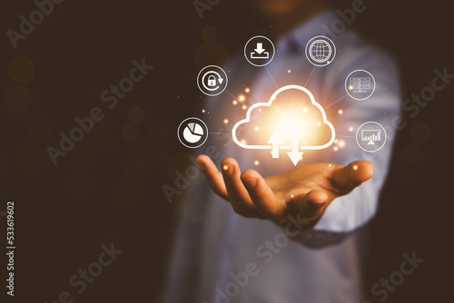 Businessman's hands showing a diagram of Cloud computing information technology icon. 