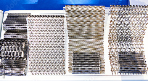 Obraz na płótnie Metal wire mesh conveyor belts on stand