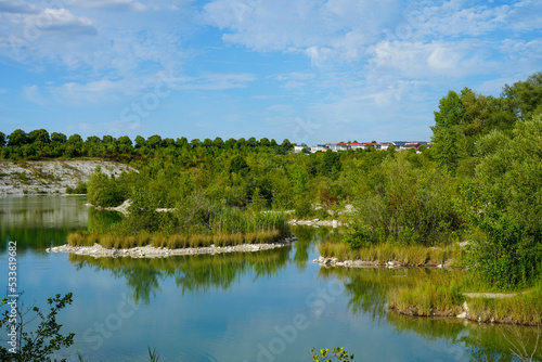 View of the Dyckerhoff lake in Beckum. Quarry west. Blue Lagoon. Landscape with a turquoise blue lake and the surrounding nature. 