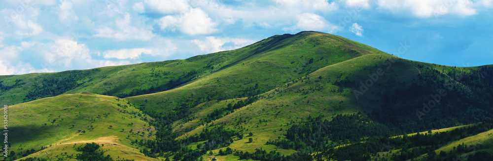 Green Zlatibor mountain hill landscape with beautiful clouds in background