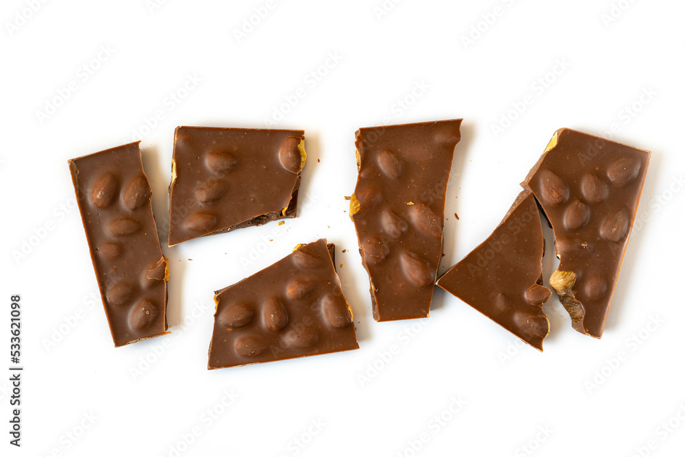 Pieces of chocolate. Broken chocolate bar on white. Pieces of chocolate. Broken chocolate bar on white.