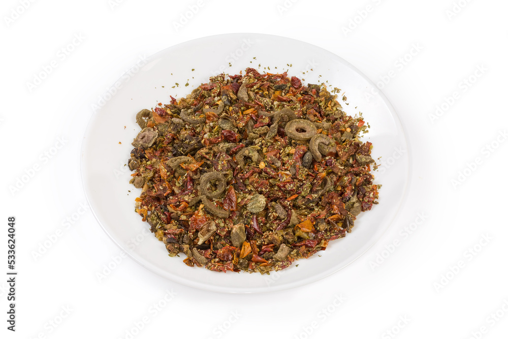 Mixture of different spices on dish on a white background Mixture of different spices on dish on a white background
