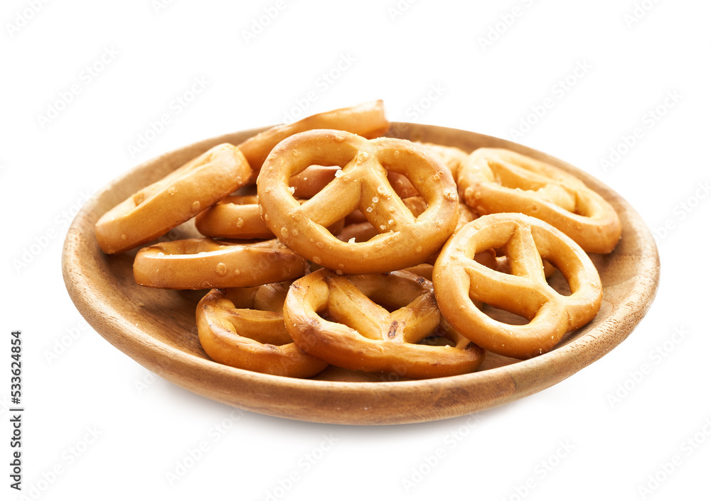 mini salted pretzel in wood plate isolated on white background. group of pretzel. mini pretzel snack isolated                                                                                  