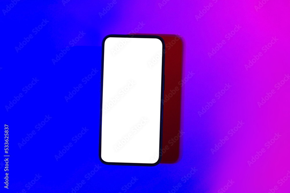 Mobile phone mockup in pink and purple light.Design template for concept design. Modern communication. Business app. Digital app mock up. Mock up template. Modern technology device screen. Mobile phone mockup in pink and purple light.Design template for concept design. Modern communication. Business app. Digital app mock up. Mock up template. Modern technology device screen.