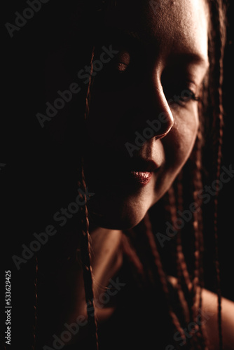 portrait of a woman with dreadlocks, dreaming