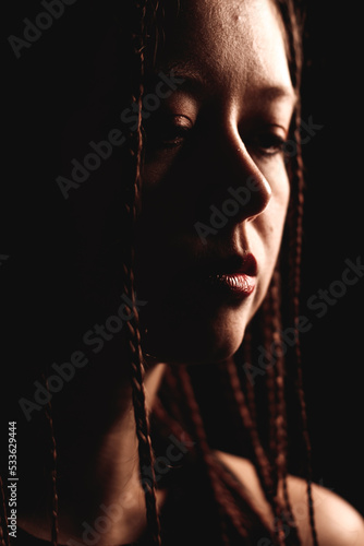 portrait of a woman with dreadlocks, dreaming