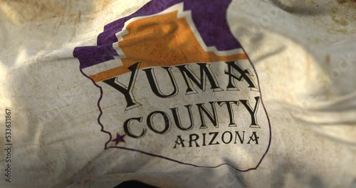 Old flag of Yuma county at sunset, state of Arizona, in United States - loop