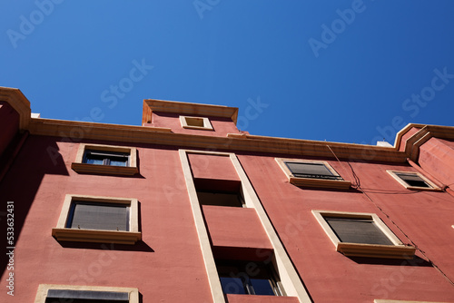 Architecture of a red house against a blue sky