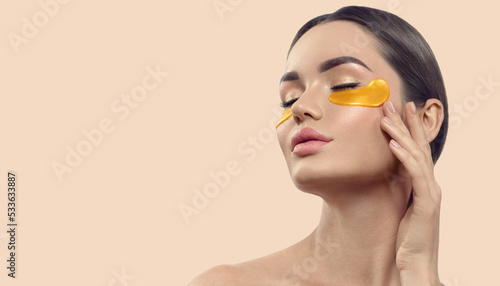 Valokuva Woman with under eye collagen gold pads, patches, beauty model girl face with healthy skin