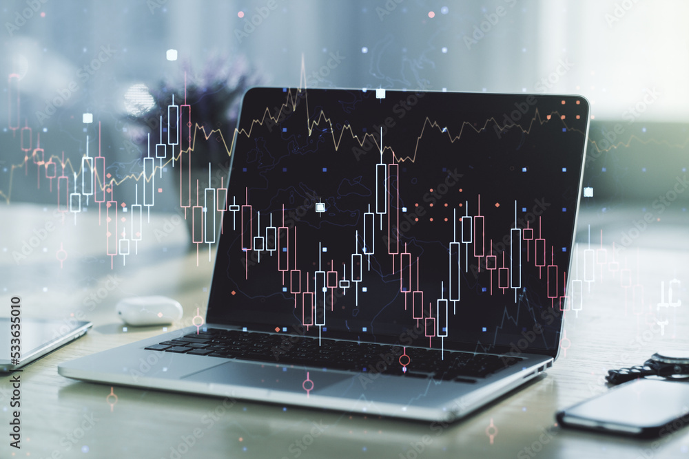 Multi exposure of abstract financial graph on laptop background, financial and trading concept Multi exposure of abstract financial graph on laptop background, financial and trading concept