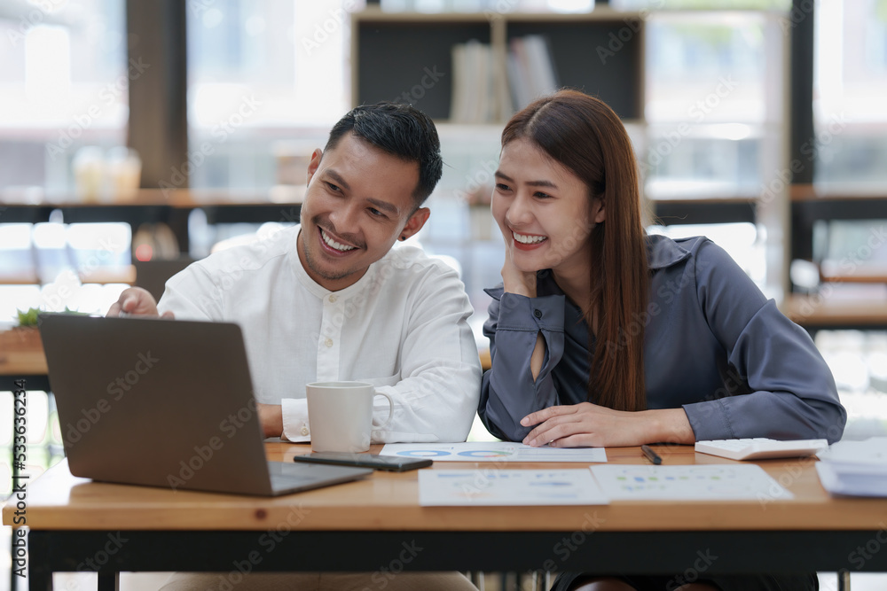 Two asian fund manager brainstorming new business project finance investment concept Two asian fund manager brainstorming new business project finance investment concept
