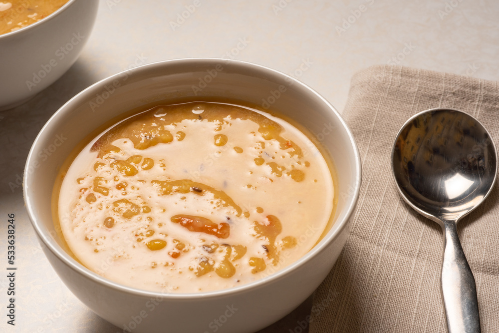 Homemade yellow split pea lentil soup served in a bowl. Arhar dal. Homemade yellow split pea lentil soup served in a bowl. Arhar dal.