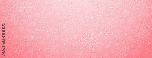 Background of complex big and small Christmas snowflakes in pink colors. Winter illustration with falling snow