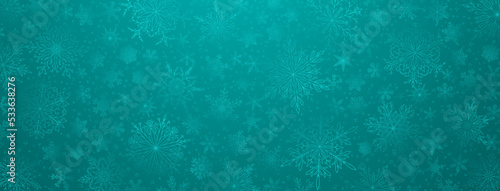 Background of complex big and small Christmas snowflakes in turquoise colors. Winter illustration with falling snow