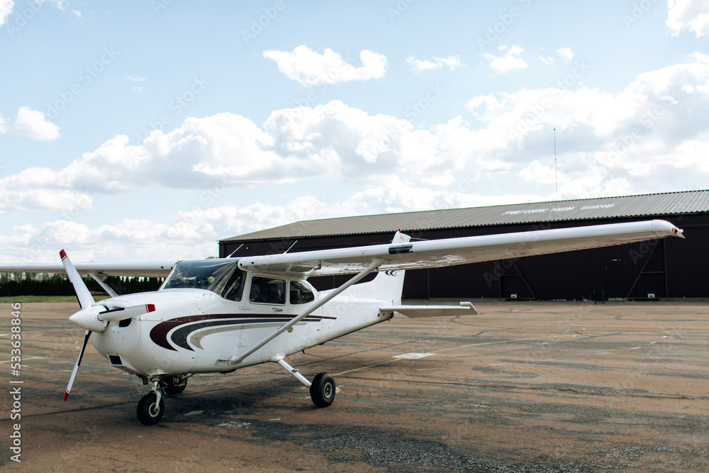 Propeller plane parking at the airport. Sunny day. Propeller plane parking at the airport. Sunny day.