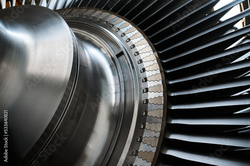 The rotor blades of a modern turbine, a close-up shot of the roots of long blades