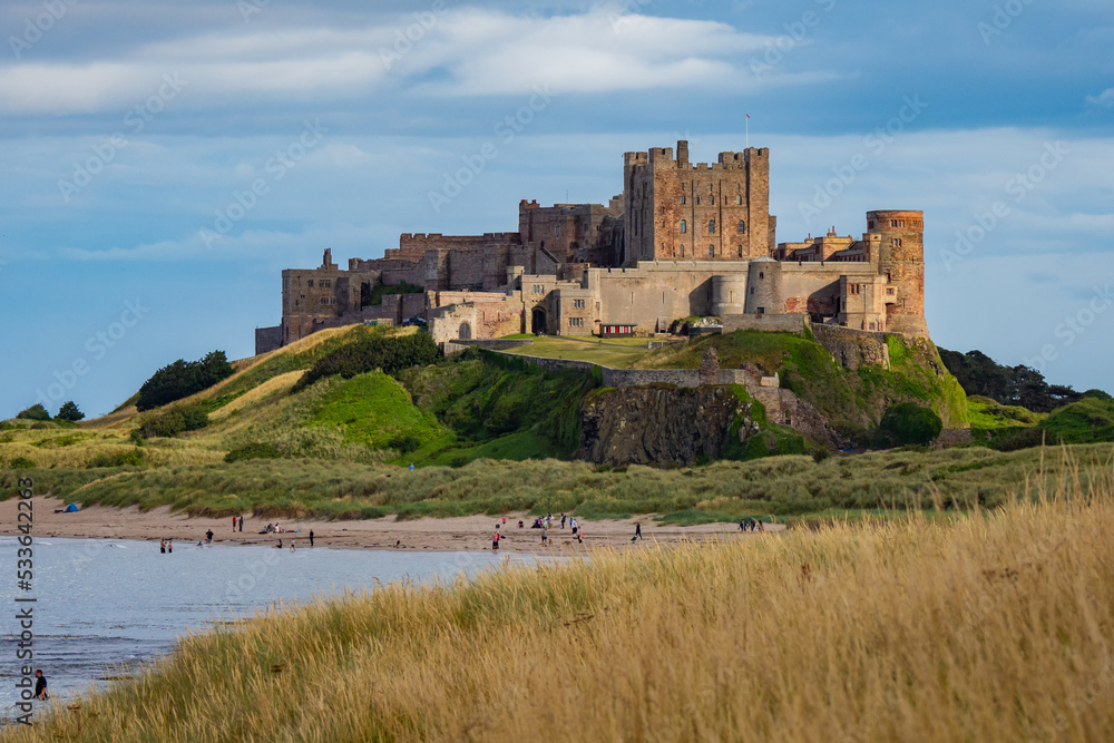 Visiting the beach beside the beautiful Bamburgh Castle in England