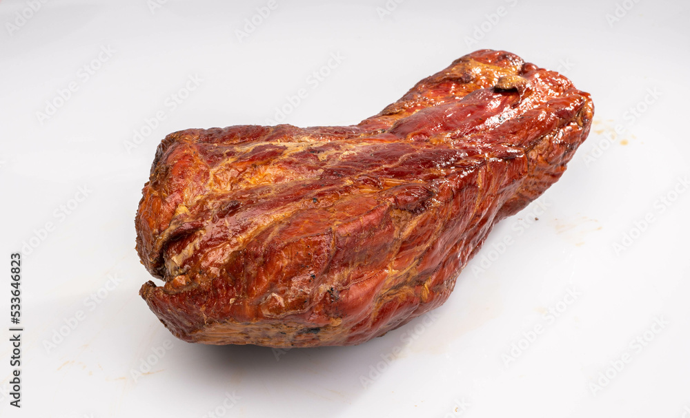 Gammon, smoked ham - in one piece, horizontal view, isolated on a white background. Polish cold cuts, a packshot photo. Gammon, smoked ham - in one piece, horizontal view, isolated on a white background. Polish cold cuts, a packshot photo.