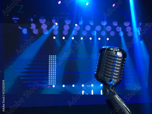 Принти на полотні Singer microphone on stage in blue lights, performing live on scene in music hal