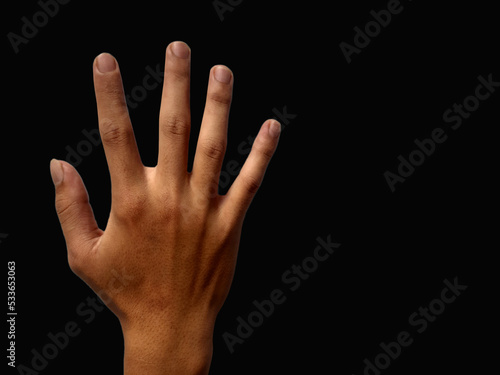Hand gesture on black background