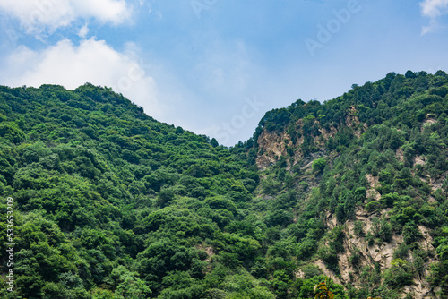 landscape in the mountains with blue sky and clouds