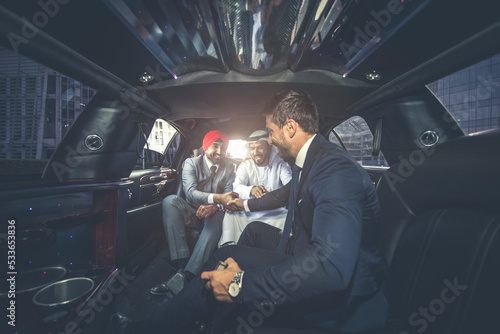 Business team talking about future plans in Dubai in the limousine © oneinchpunch