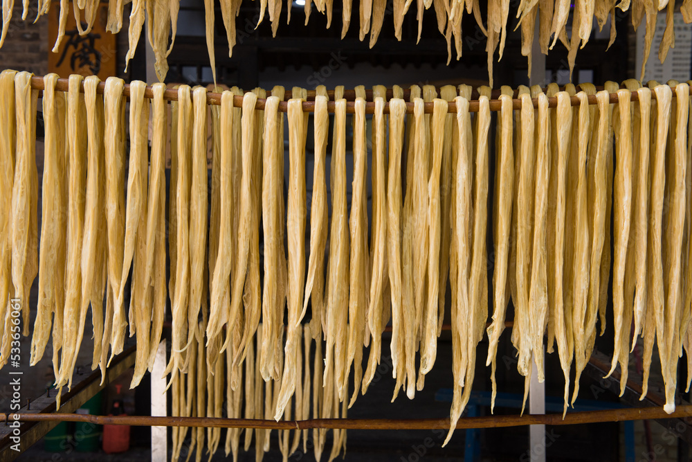 Dried yuba sticks hanging on shelf,beancurd stick made. Dried yuba sticks hanging on shelf,beancurd stick made.