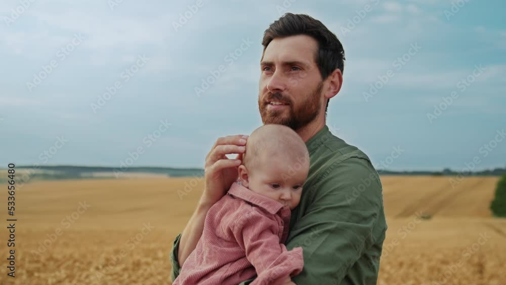 Baby girl and dad travel on field. Happy family, child and father walk together on plantation in summer. Kid dream concept.