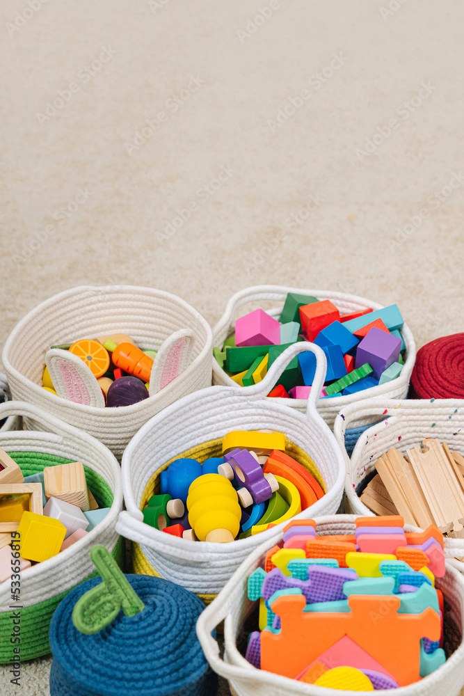 Colorful Toy Storage Baskets in the children's room. Cloth stylish