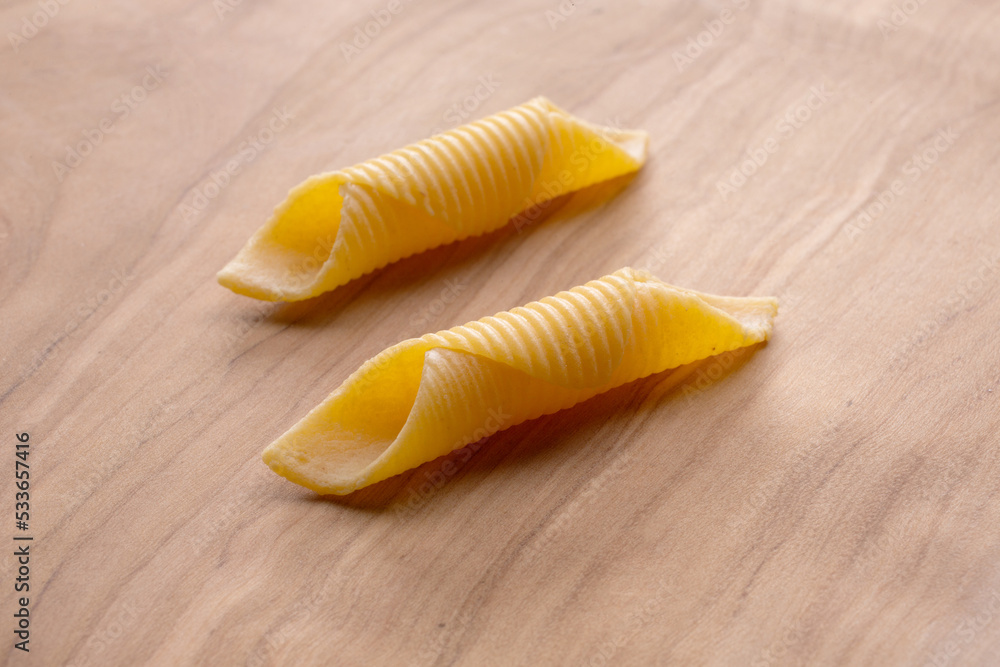 short pasta compositions on wooden background Stock Photo | Adobe Stock