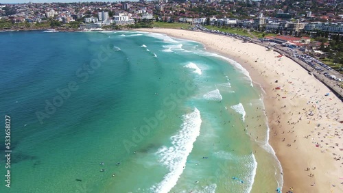 Aerial drone view of iconic Bondi Beach in Sydney, Australia approaching from North Bondi heading South on a sunny day during spring 2022   photo