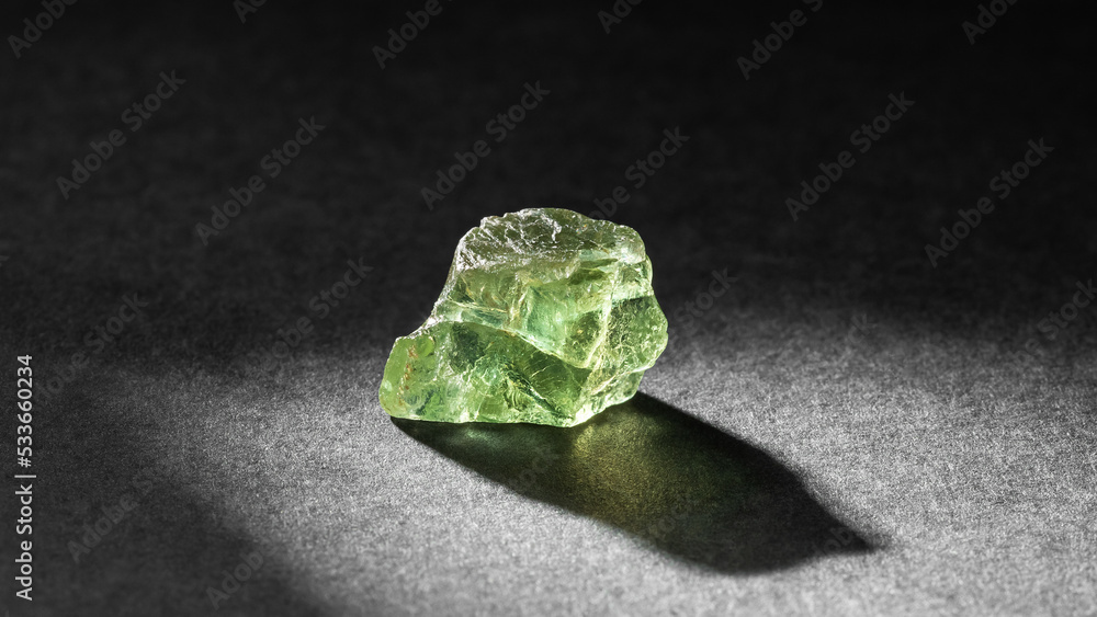 Apatite crystal healing stone on black background Apatite crystal healing stone on black background