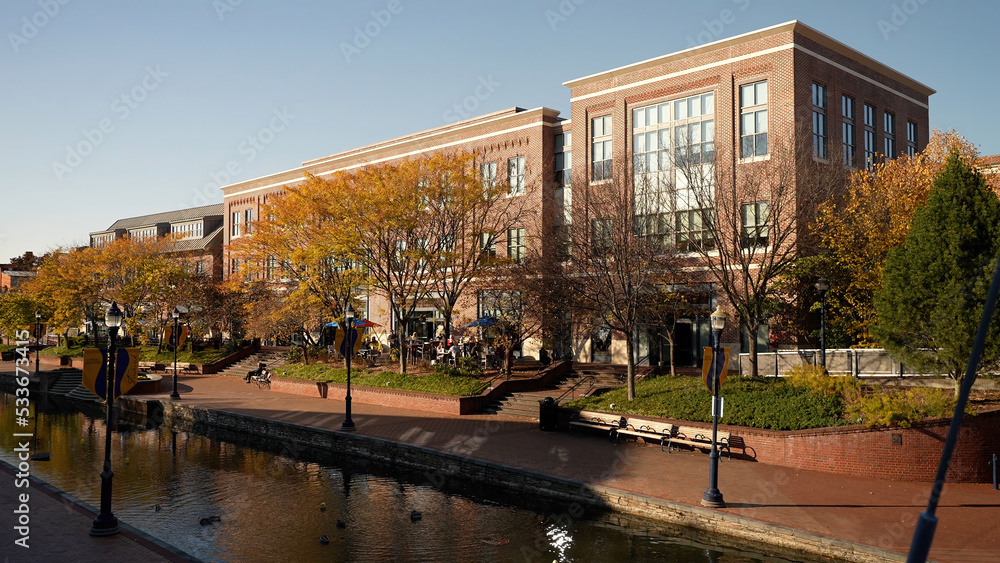 Carroll Creek Park in historic district of Frederick with shops and building on sides of the canal.