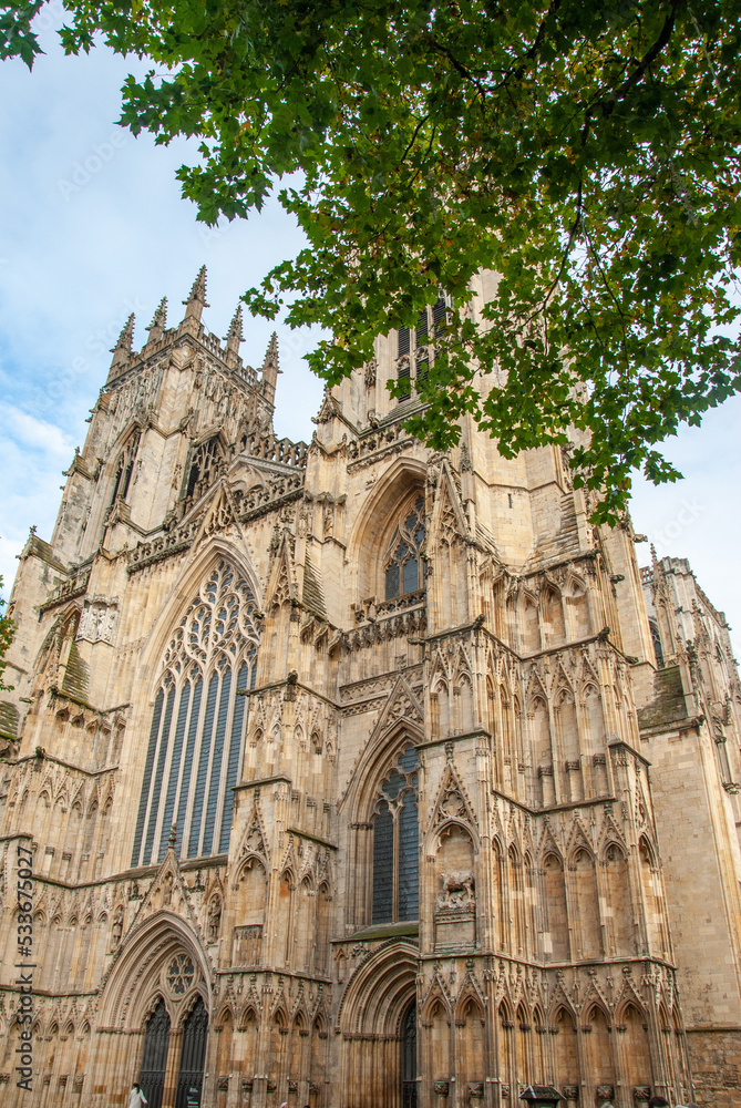 Facade view of the 13th century medieval Gothic style Cathedral and Metropolitical Church of Saint Peter in York, commonly known as York Minster, in North Yorkshire, England, UK