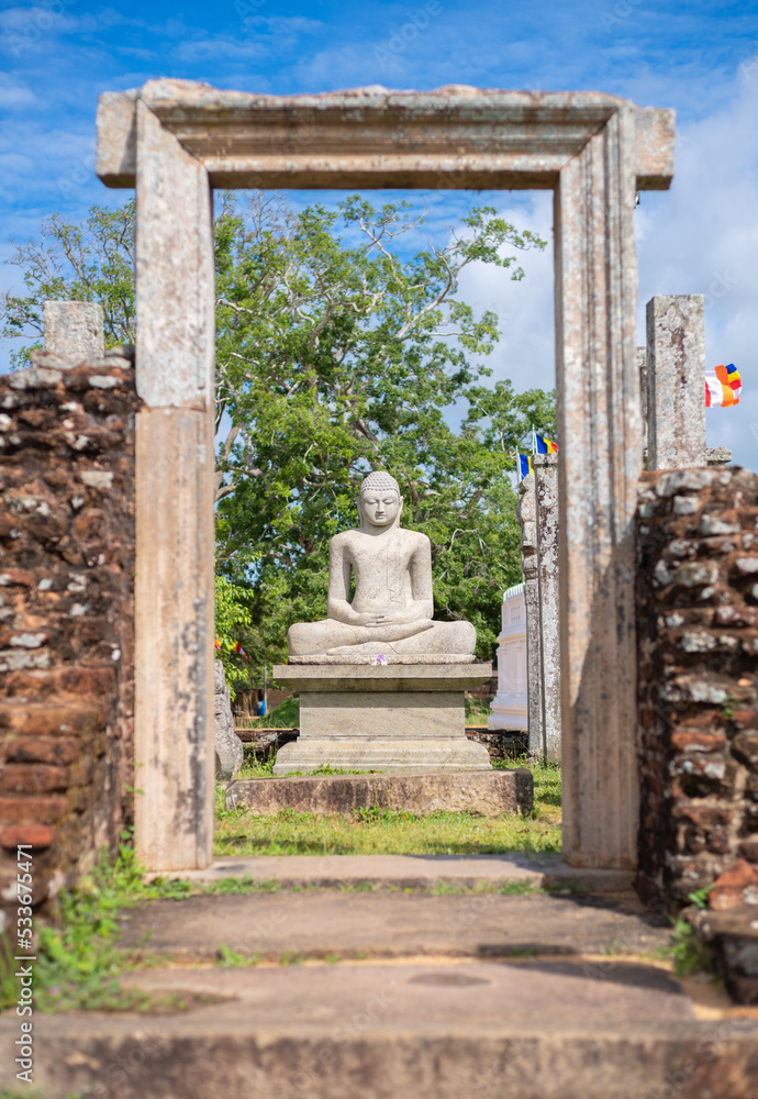 Thuparama Buddha statue and the temple ruins. world heritage site in the sacred city of Anuradhapura.