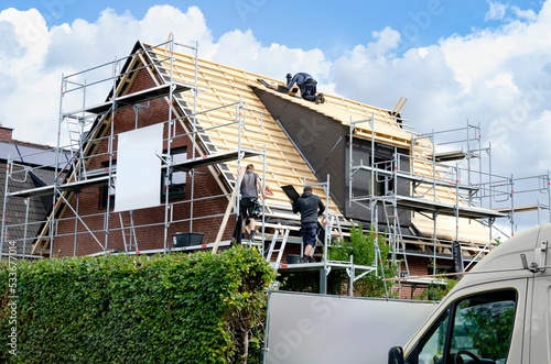 Roofers during the roof renewal