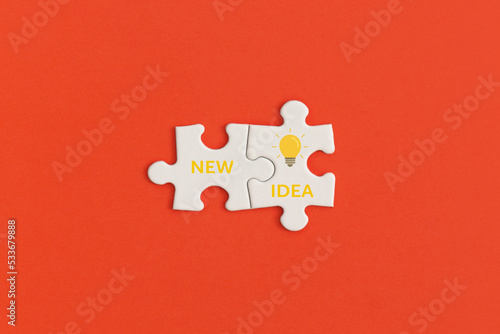 White details of puzzle on red background. Inspiration and creative idea concept.