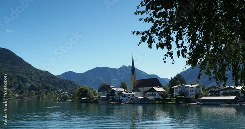 View of Rottach-Egern and Laurentius church on the shore of Tegernsee lake Tegernsee in Bavarian Alps in Germany photo