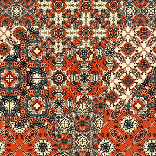 Patchwork seamless pattern from patches with ethnic ornaments. Creative print for fabric. Oriental motifs.