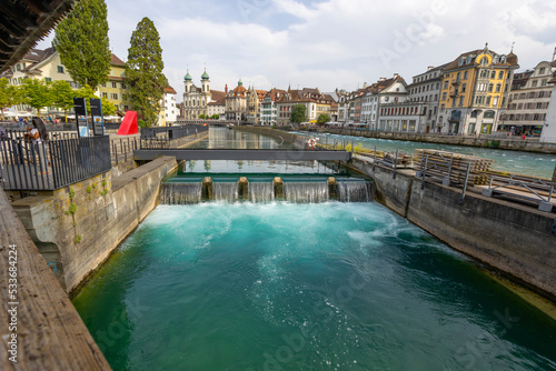 LUCERNE, SWITZERLAND, JUNE 21, 2022 - View of the Jesuit church of St. Franz Xaver on the Reuss river in Lucerne, Switzerland