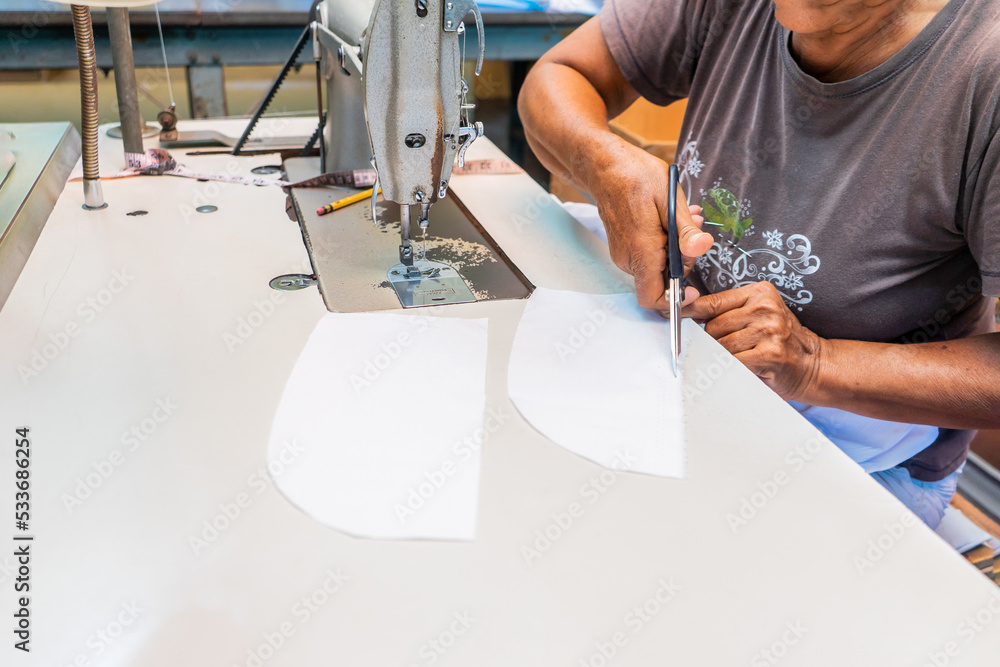 custom made wallpaper toronto digitalUnrecognizable Latin woman cutting pieces of a guayabera shirt