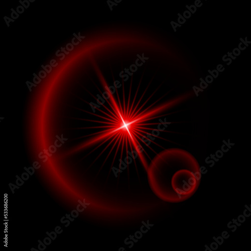 A red star. Light lines. Blurred lens lighting effect on a black background.